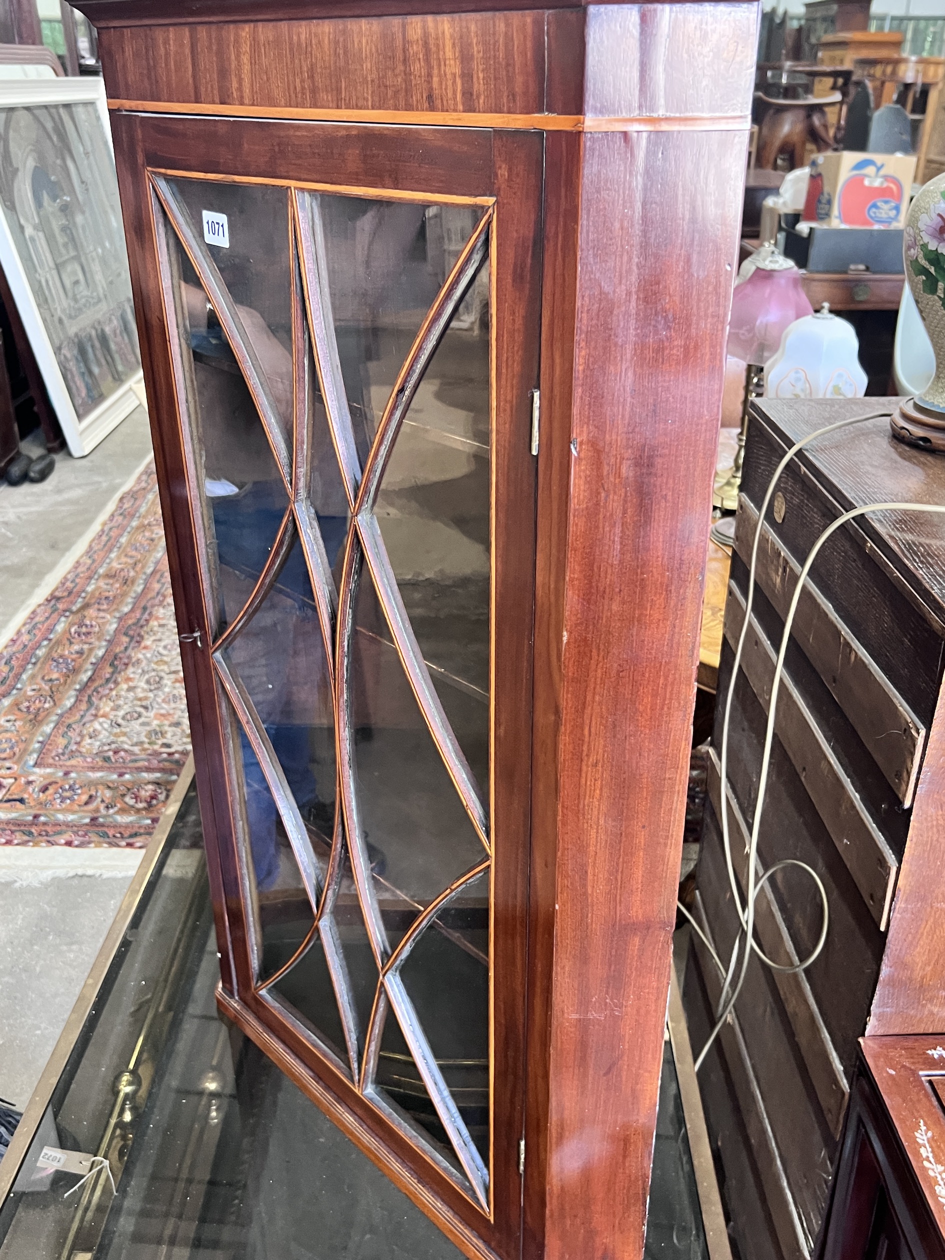 A George III inlaid mahogany hanging corner cupboard, width 64cm, depth 38cm, height 100cm